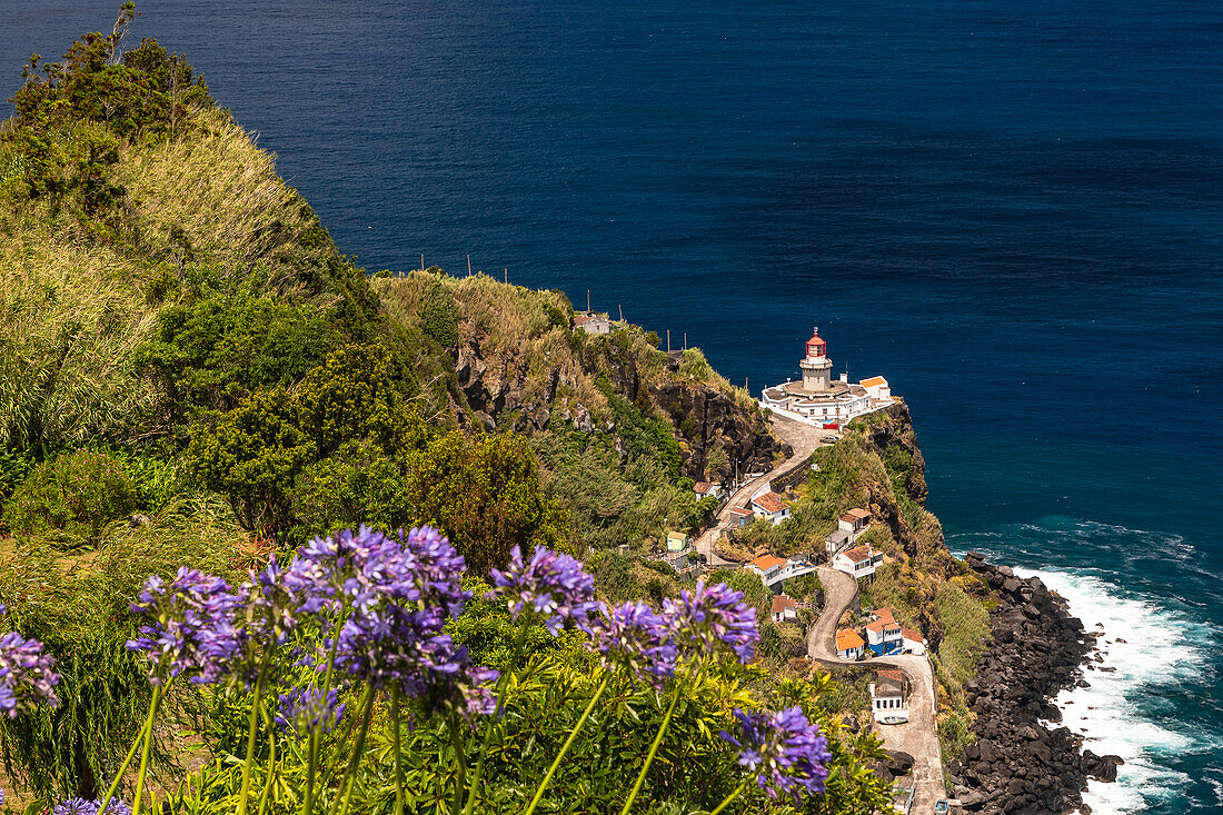 The picturesque harbor and lighthouse by the sea on the Portuguese island of São Miguel