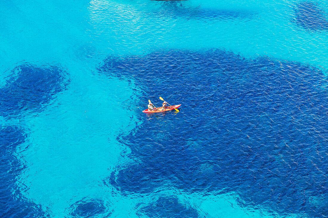 People canoeing near Cala Mitjana, Minorca, Balearic Islands, Spain