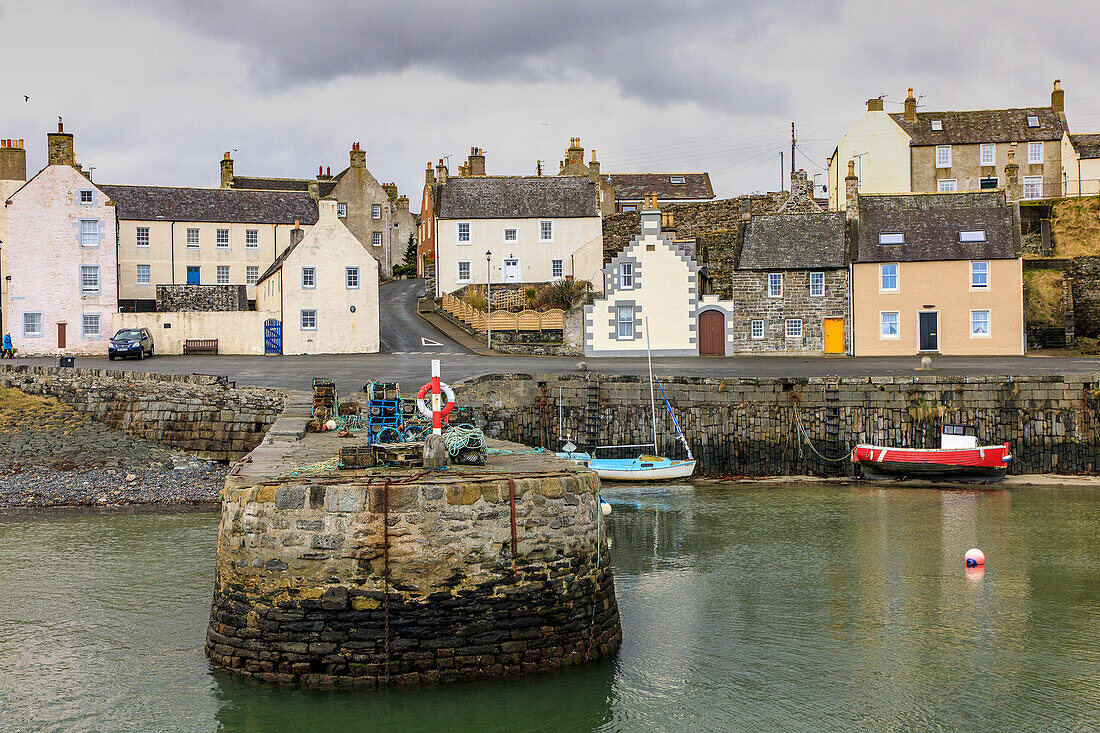 Lifebuoy, fishing boat, low tide, historic harbor, fishing village of Portsoy, near Banff, Aberdeenshire, Scotland, UK