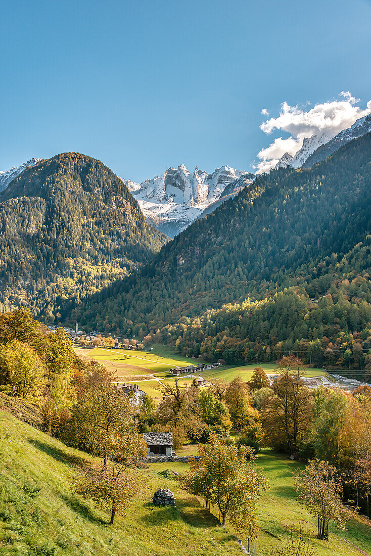 View from Soglio to the village of Bondo in Bergell, Grisons, Switzerland, with the Piz Cengalo in the background