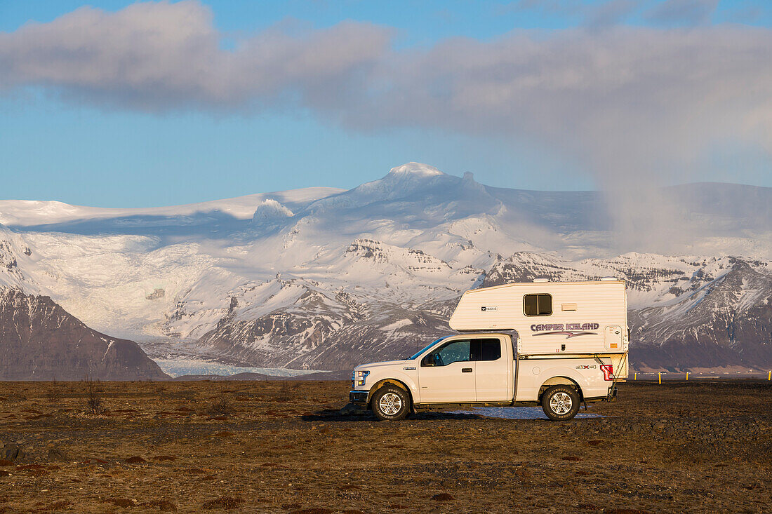 Campers in front of the glacier outgrowths of Vatnajokull, south coast, Iceland