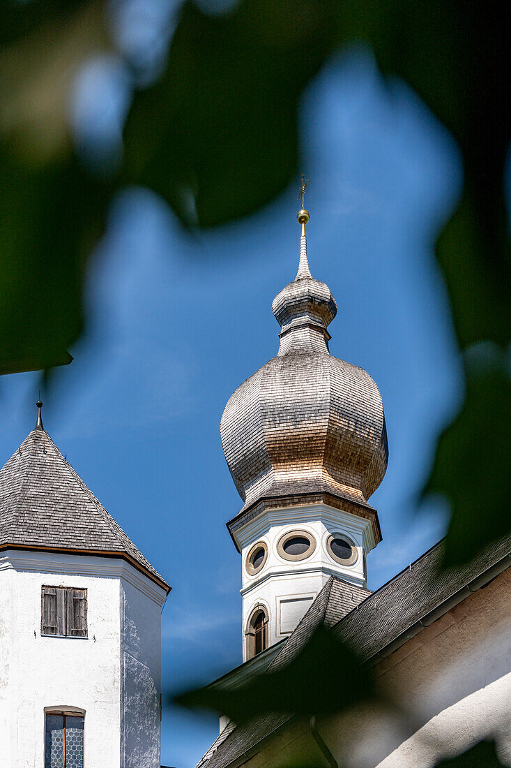 Looking up to the church tower from Höglwörth Monastery, Chiemgau, Bavaria, Germany