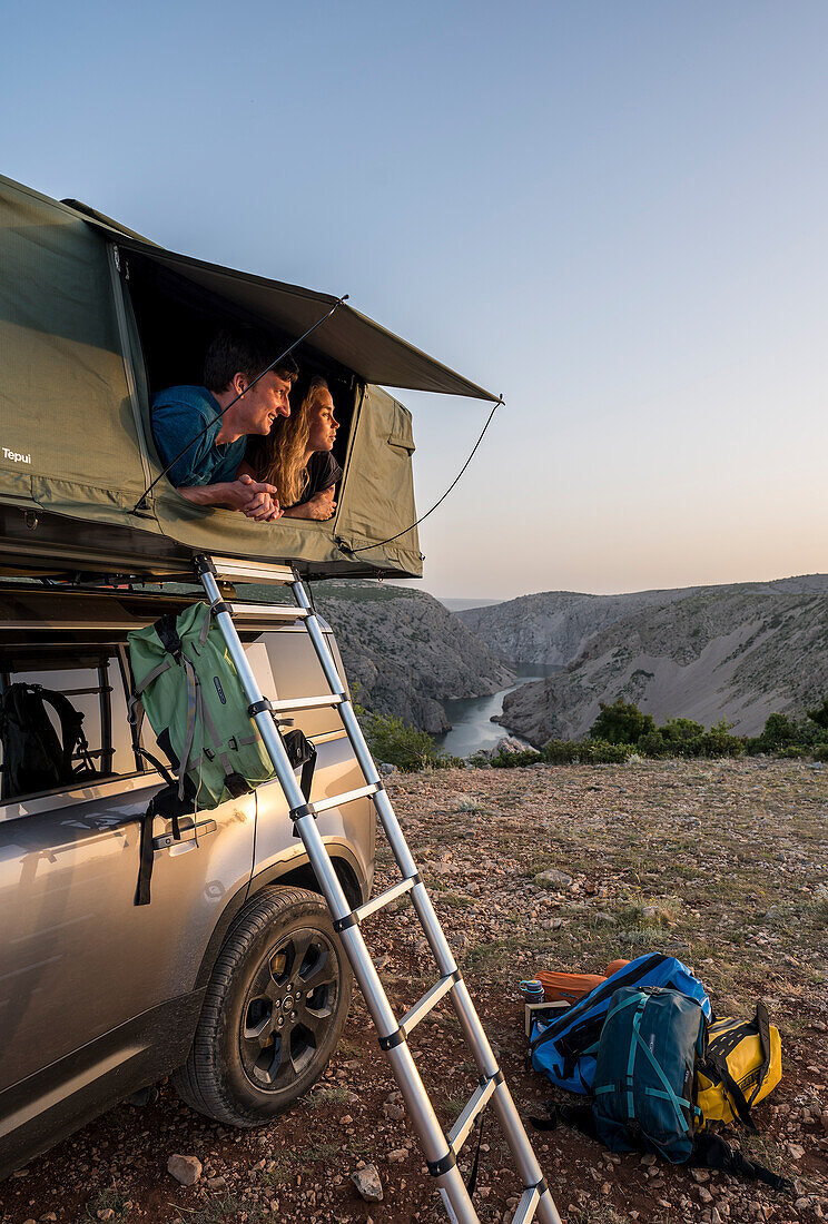 Croatia, Zrmanja, Winnetou, couple in the roof tent on an off-road vehicle