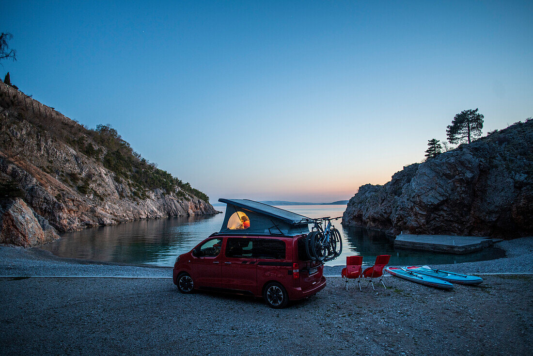 Road trip Croatia, in the evening with the camper on the coast