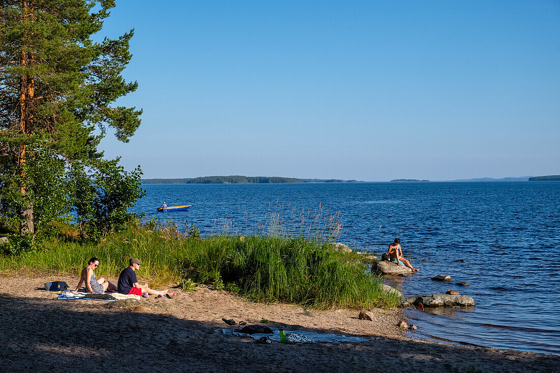 People bathe at Lake Pielinen, Finland