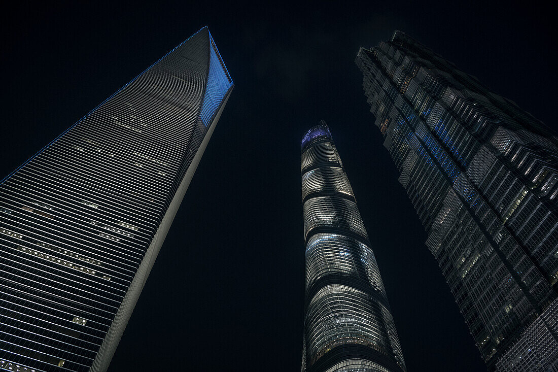 Shanghai World Financial Tower, Shanghai Tower and Jin Mao Tower illuminated at night, Pudong, Shanghai, People's Republic of China, Asia