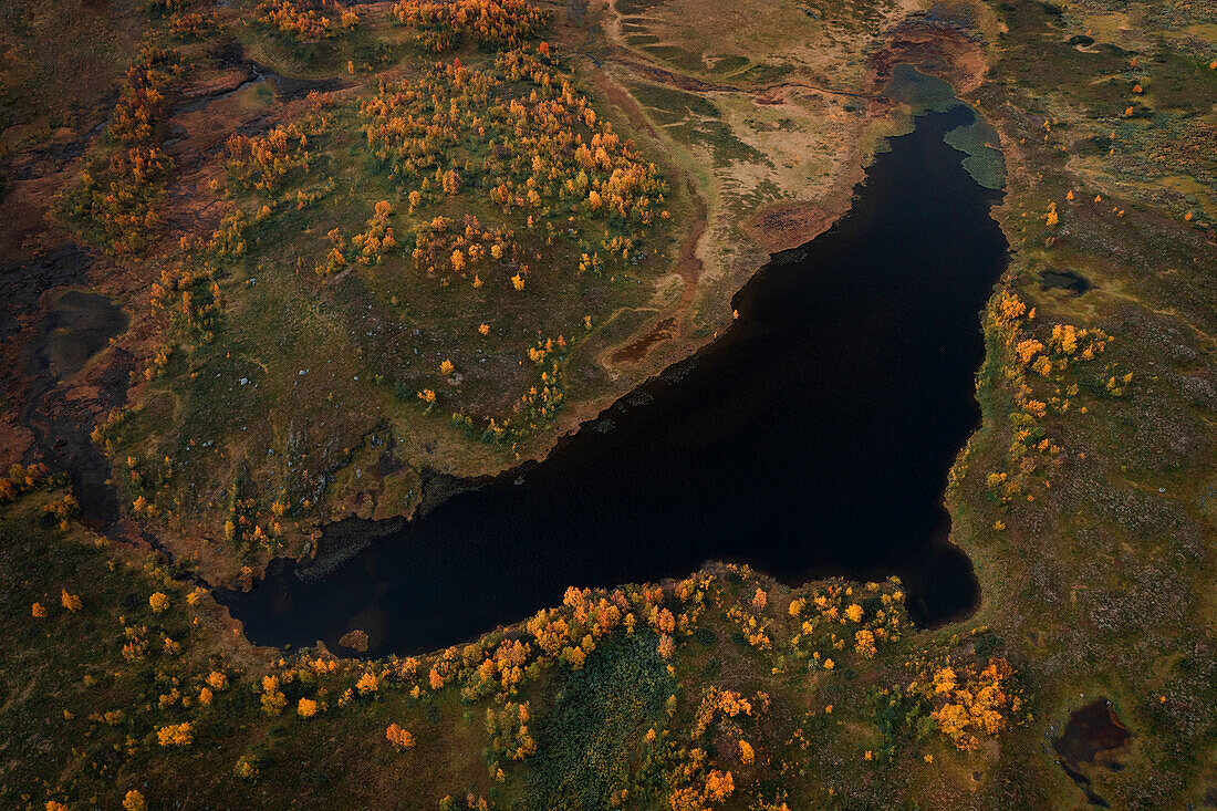 Lake along the Wilderness Road, on the Vildmarksvagen plateau in Jämtland in autumn in Sweden from above