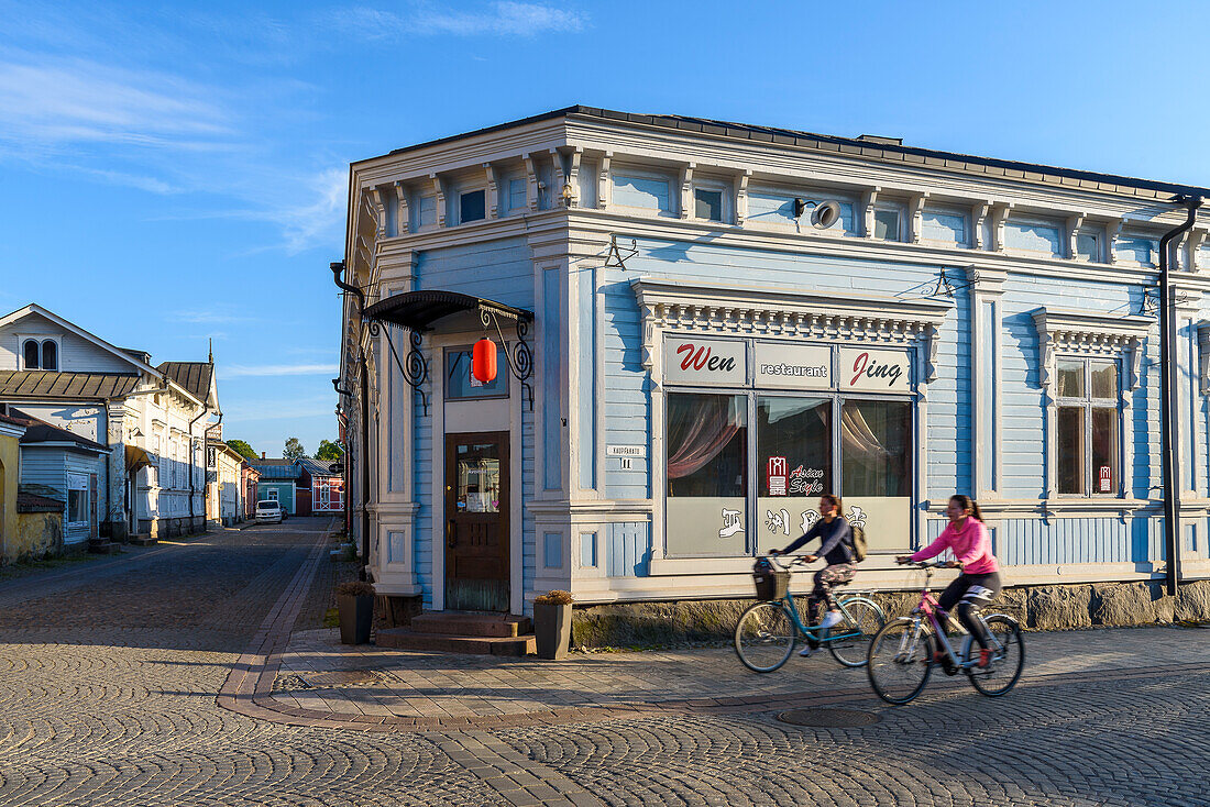 Women with bicycles, street scenes in the old town of Rauma, West Coast, Finland