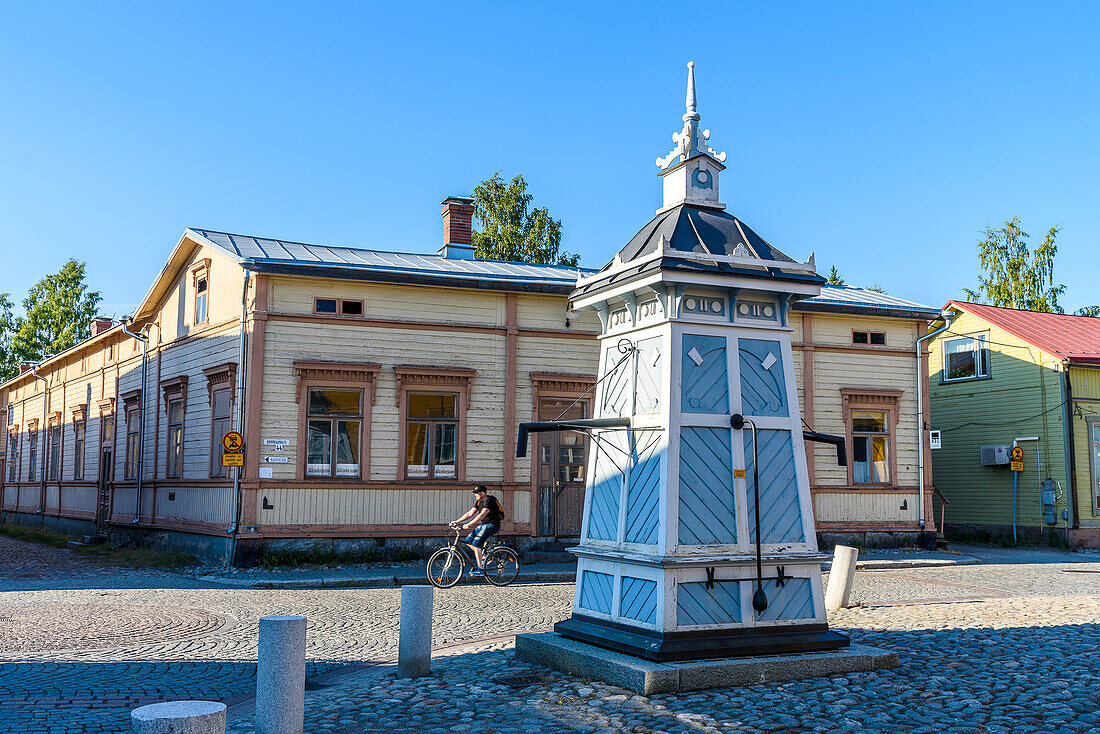 Old fountain with wooden paneling, street scenes in the old town of Rauma, west coast, Finland