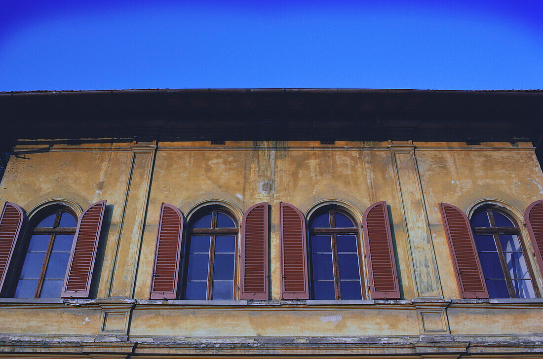 Architectural details of windows with shutters, Rome, Italy