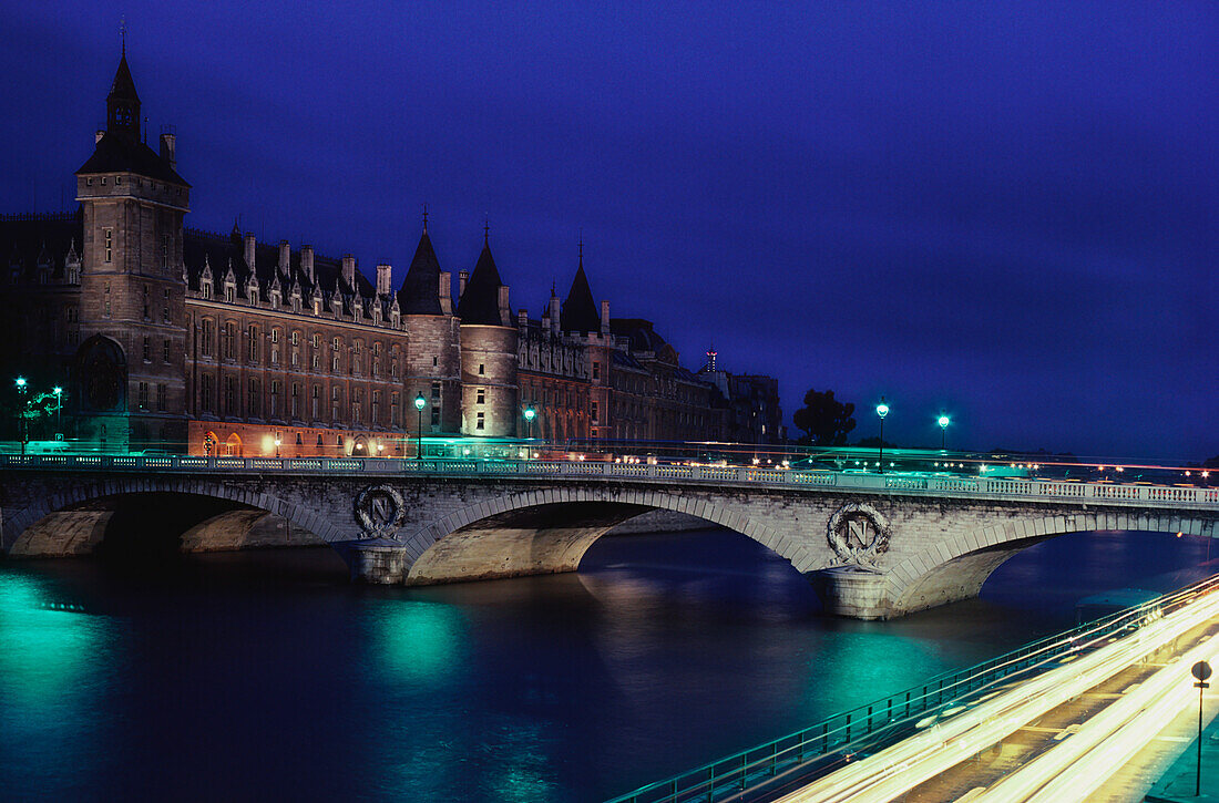 Bridge over a river lit up at night, Palais de Justice, Seine River, Paris, Ile-de-France, France