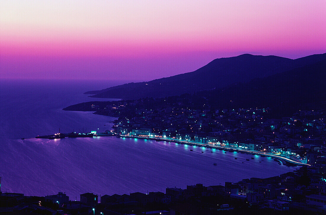 High angle view of a city at night, Samos, Greece