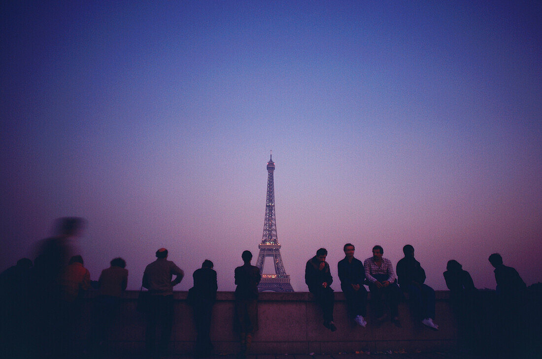 Tourists looking at a tower from an observation point, Eiffel Tower, Paris, Ile-de-France, France