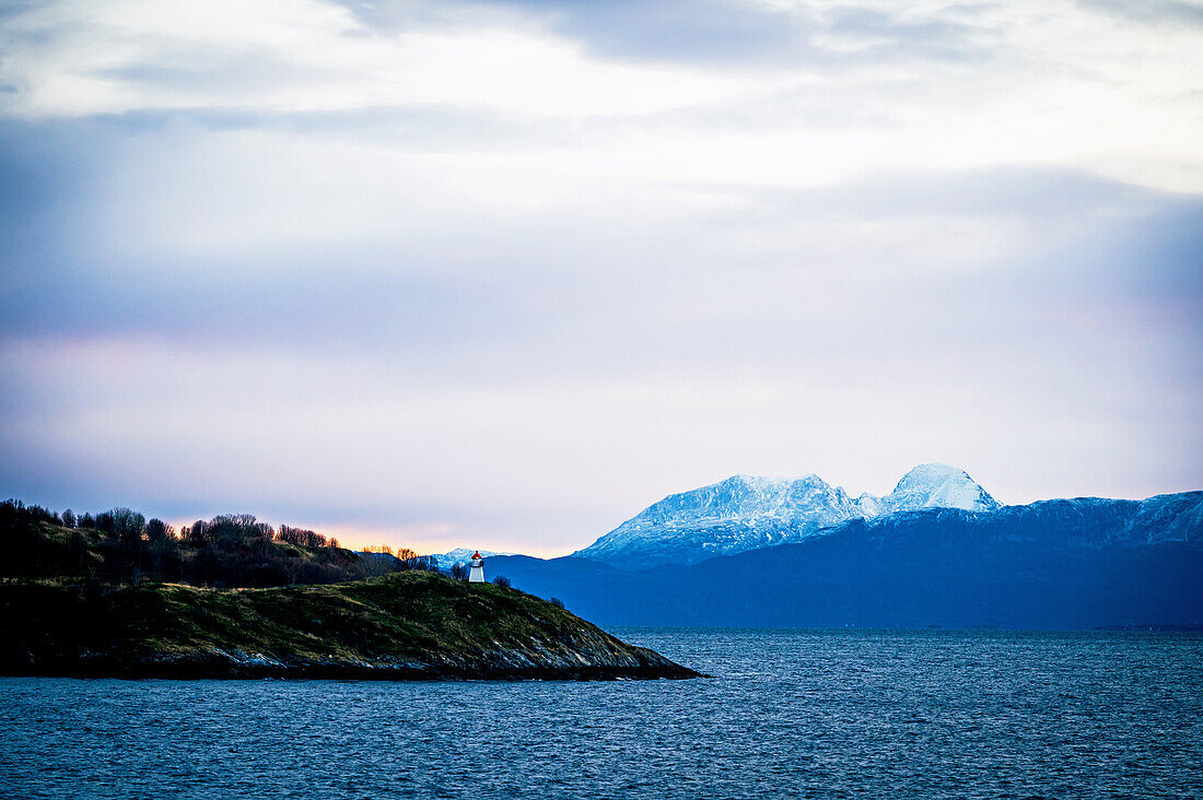 Coastal landscape at Risoyhamn with beacon, Nordland, Norway, Europe