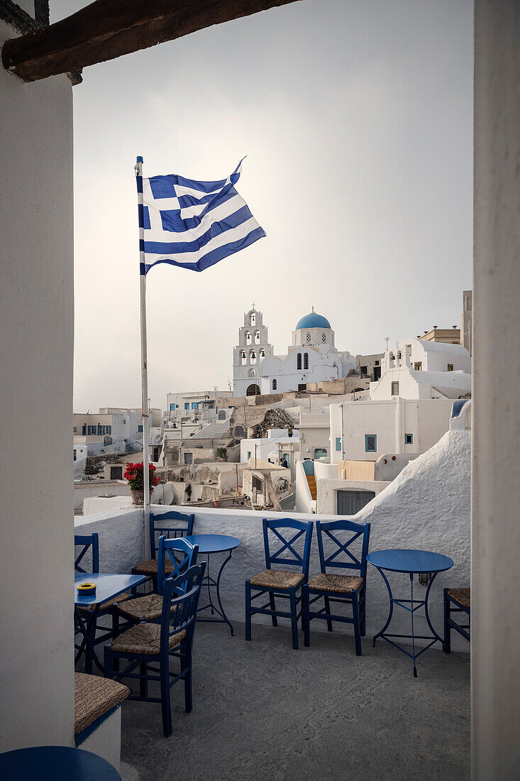 Greek flag in front of Greek Orthodox Church, Pyrgos, Santorini, Santorin, Cyclades, Aegean Sea, Mediterranean, Greece, Europe