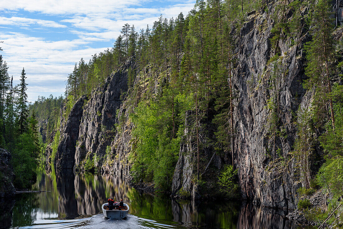 Tour boat on Julma Ölkky canyon lake, Finland