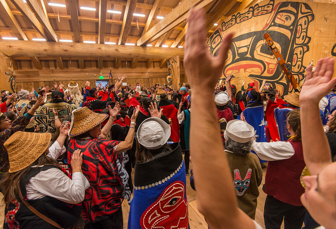 Opening ceremonies in the Glacier Bay Tribal House with Native Alaskan Tlingit people singing and dancing
