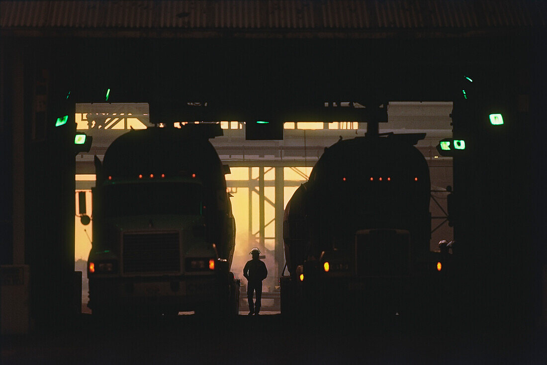 Trucks loading fertilizer at a chemical plant, Yazoo City, Yazoo County, Mississippi, USA