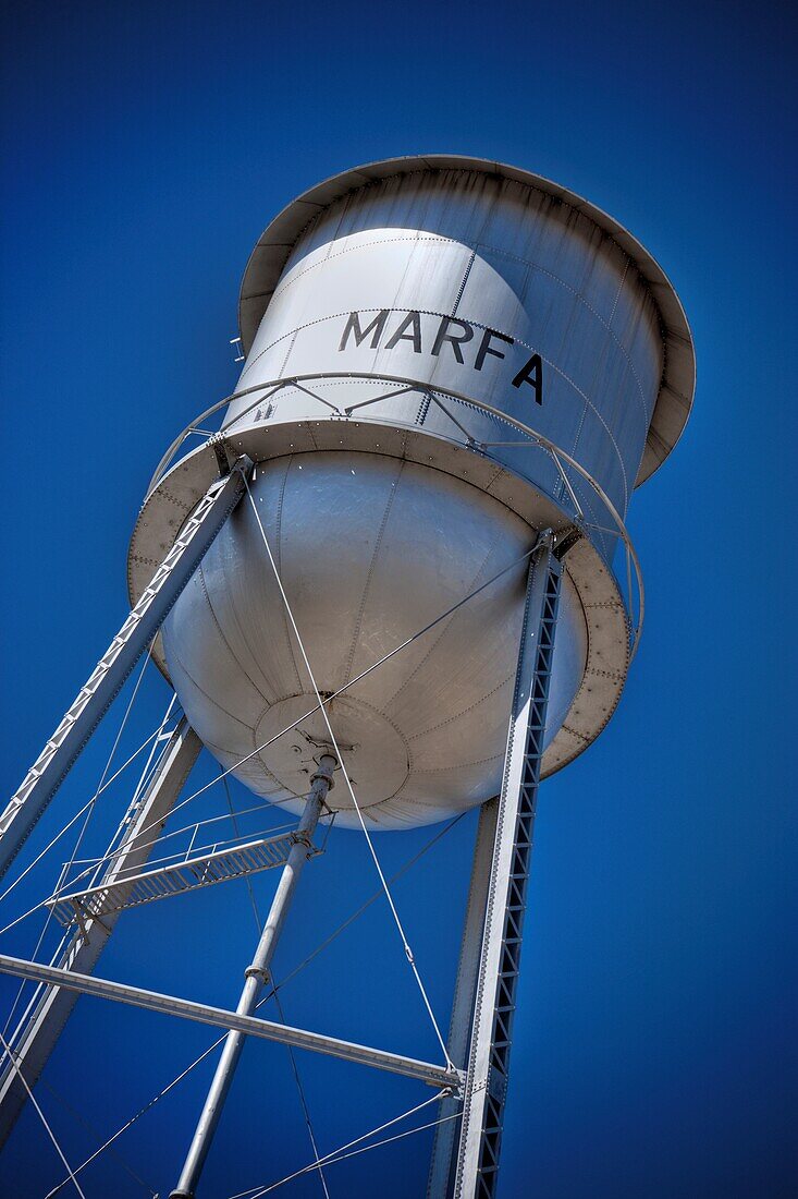 Low angle view of a water tower against blue sky, Marfa, Texas, USA