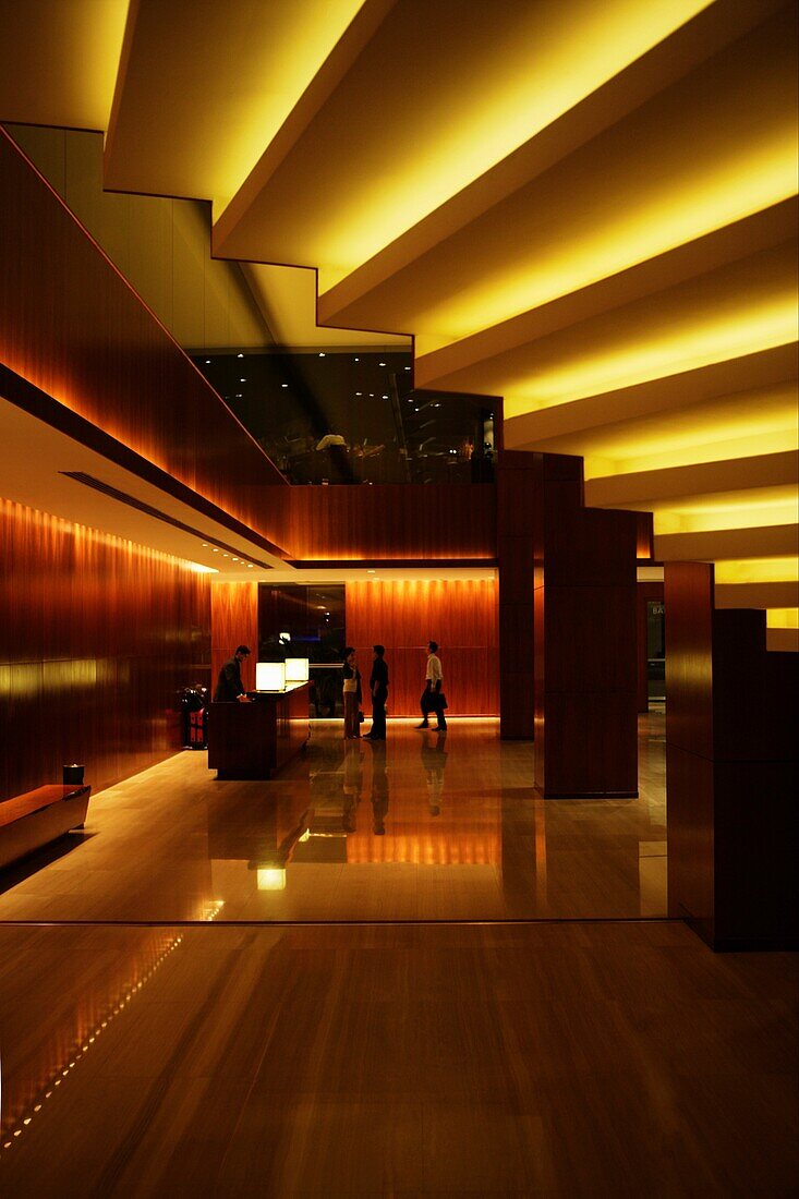 Looking out from underneath a lighted staircase in the Grand Hyatt hotel lobby, Little India, Singapore