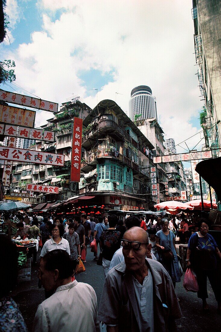 People shopping at street market in a city, Hong Kong