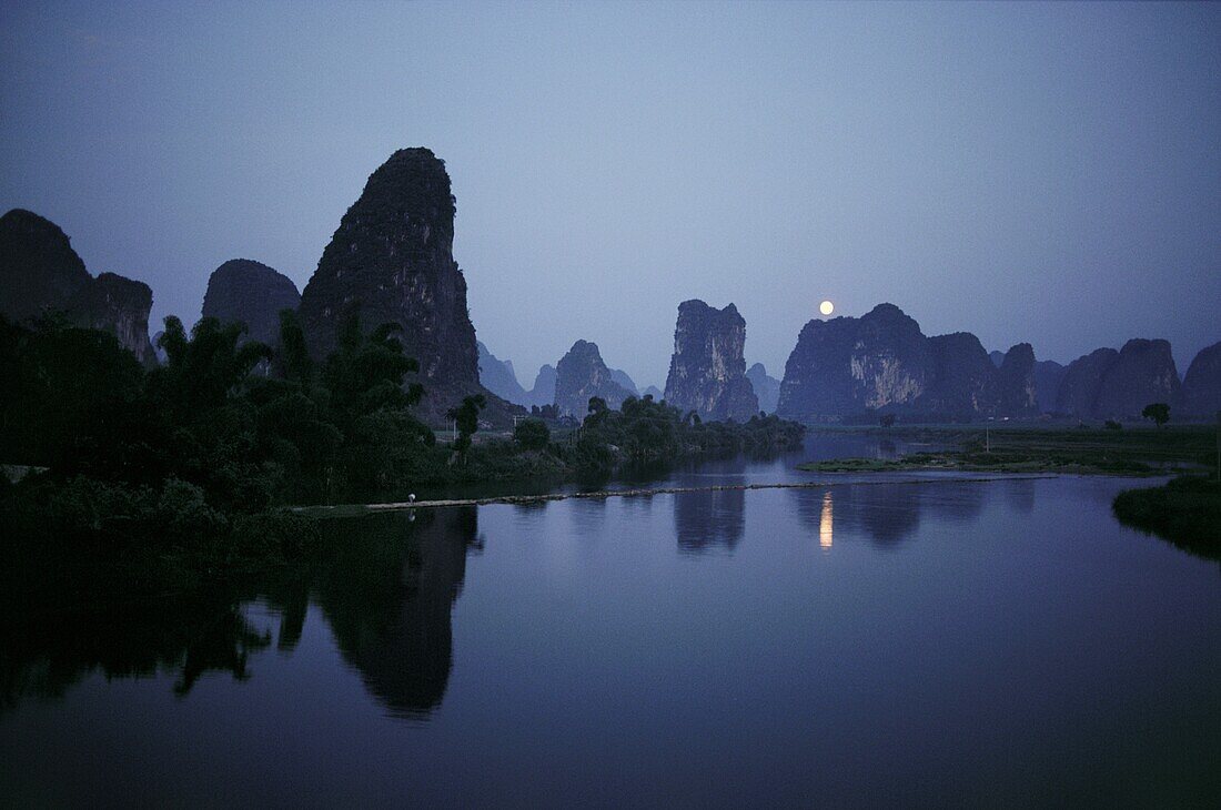 Reflections of mountains in the water, Yangshuo, Guangxi Province, China