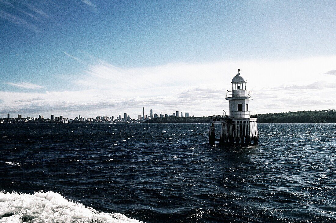 Lighthouse with buildings in the background, Sydney, New South Wales, Australia