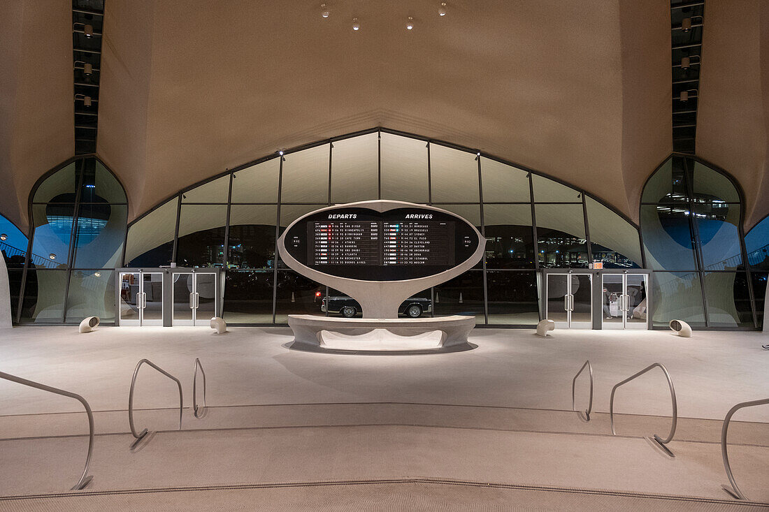 Night shot of the arrivals and departures board in the lobby of the TWA hotel at JFK Airport