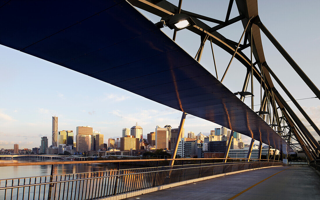 Modern Pedestrian Bridge spanning over Brisbane River linking city to Southbank in early morning light