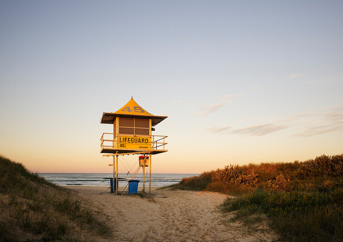 Late afternoon shot of lifeguard tower on empty beach