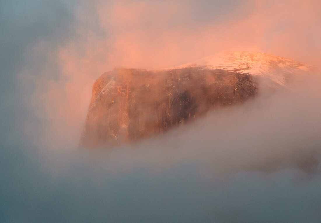 Sunset and pink fog on Half Dome in Yosemite