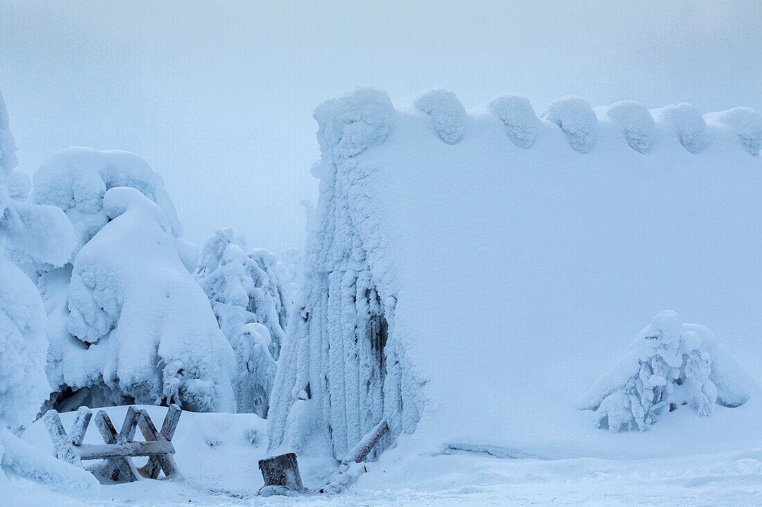 A Wood Shed in Finnish Lapland covered in snow after a blizzard. Chocolate Box Winter Scene