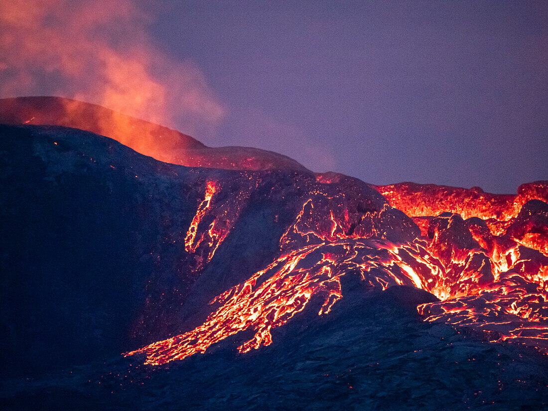 Glowing lava at twilight, Fagradalsfjall Volcano from Observation Hill, Iceland