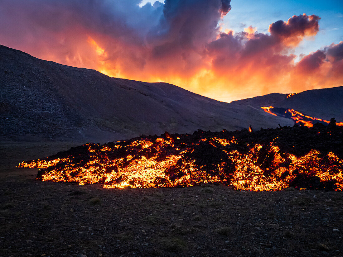 Glowing river of lava at sunset, Fagradalsfjall volcanic eruption at Geldingadalir, Iceland