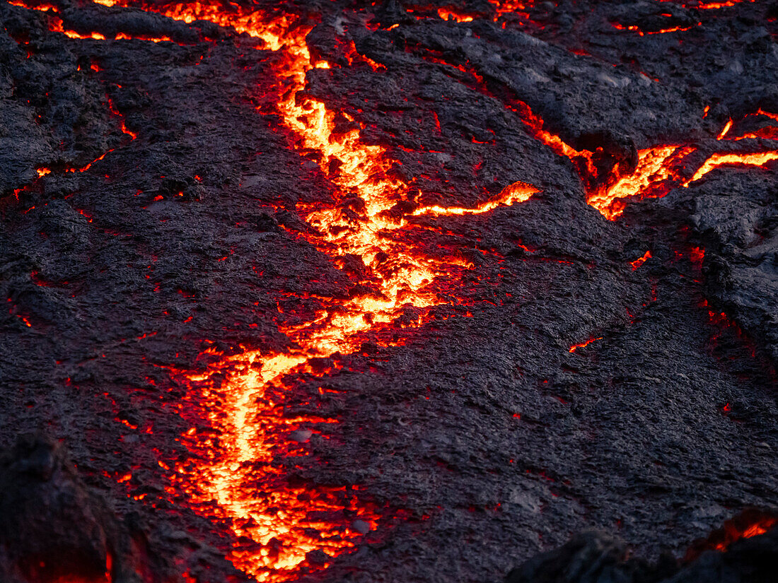 Cracks in lava flow and glowing magma, Fagradalsfjall Volcano, Iceland