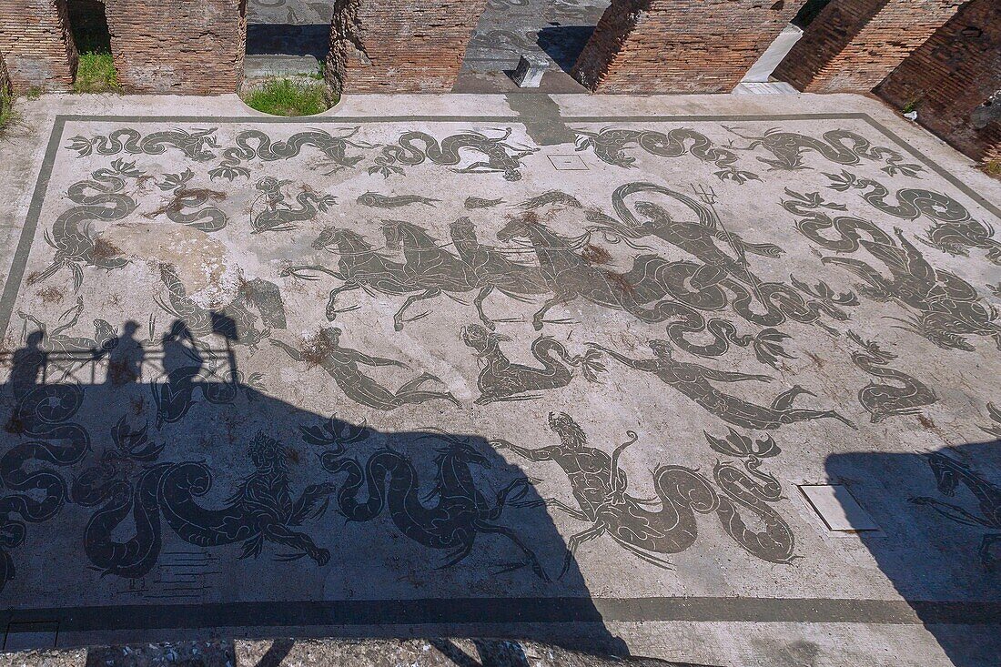Rome, Ostia Antica, Terme di Nettuno, Mosaic floor, shadows of tourists on viewing terrace