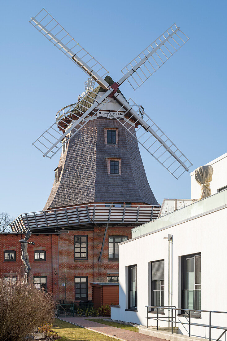 Historical mill in the city center of Warnemünde in the morning.