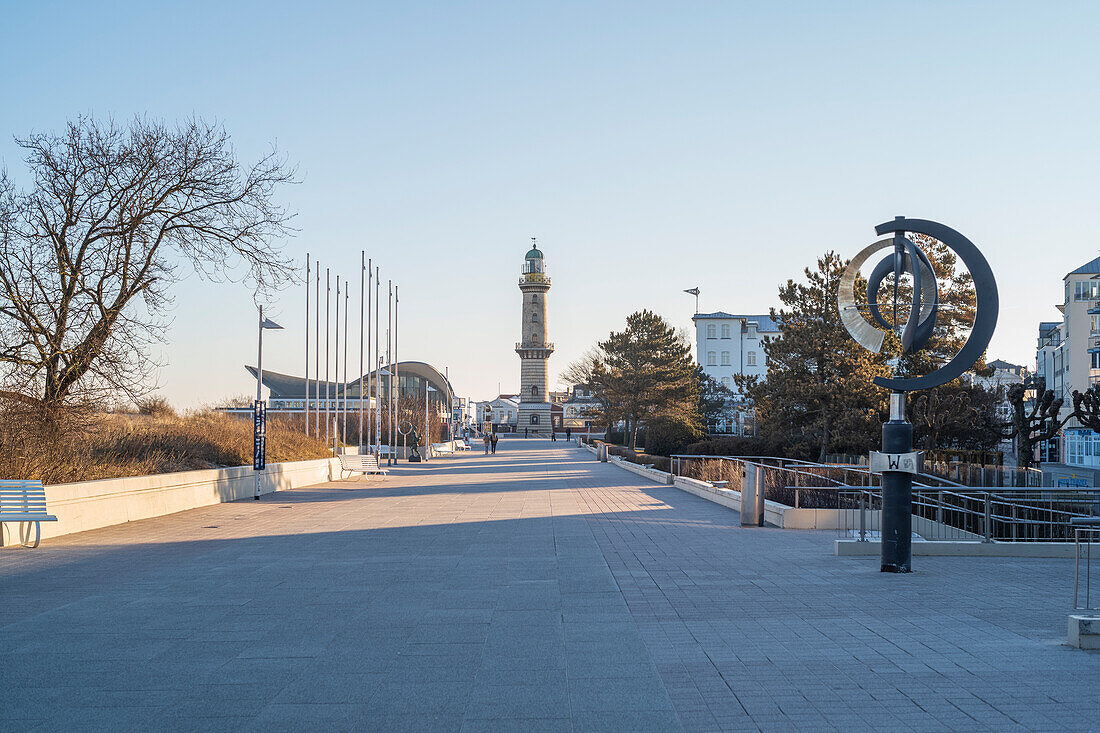 View of the lighthouse with a shell in Warnemünde in the morning.