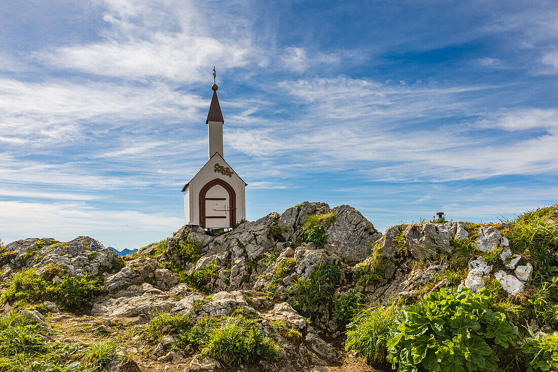 Small chapel at the summit of the Hochgerns in summer, with light clouds. deserted. Marquartstein, Chiemgau Alps, Eastern Alps, Upper Bavaria, Bavaria, Germany, Europe