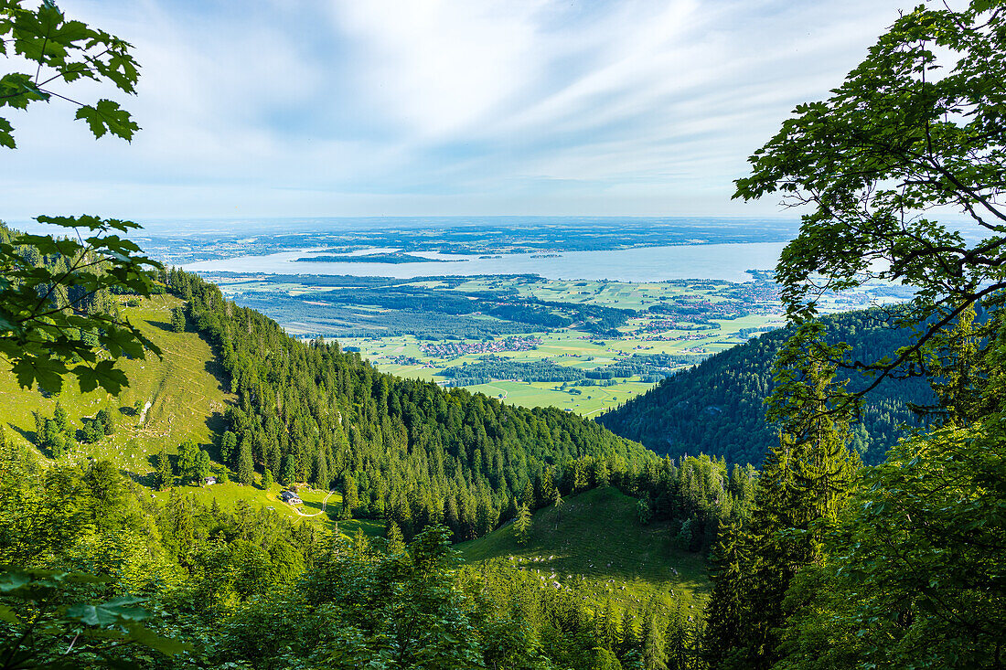 View of the Chiemsee from Hochgern, you can see the Staudacher Alm, heavy clouds. Marquartstein, Chiemgau, Chiemgau Alps, Upper Bavaria, Bavaria, Germany