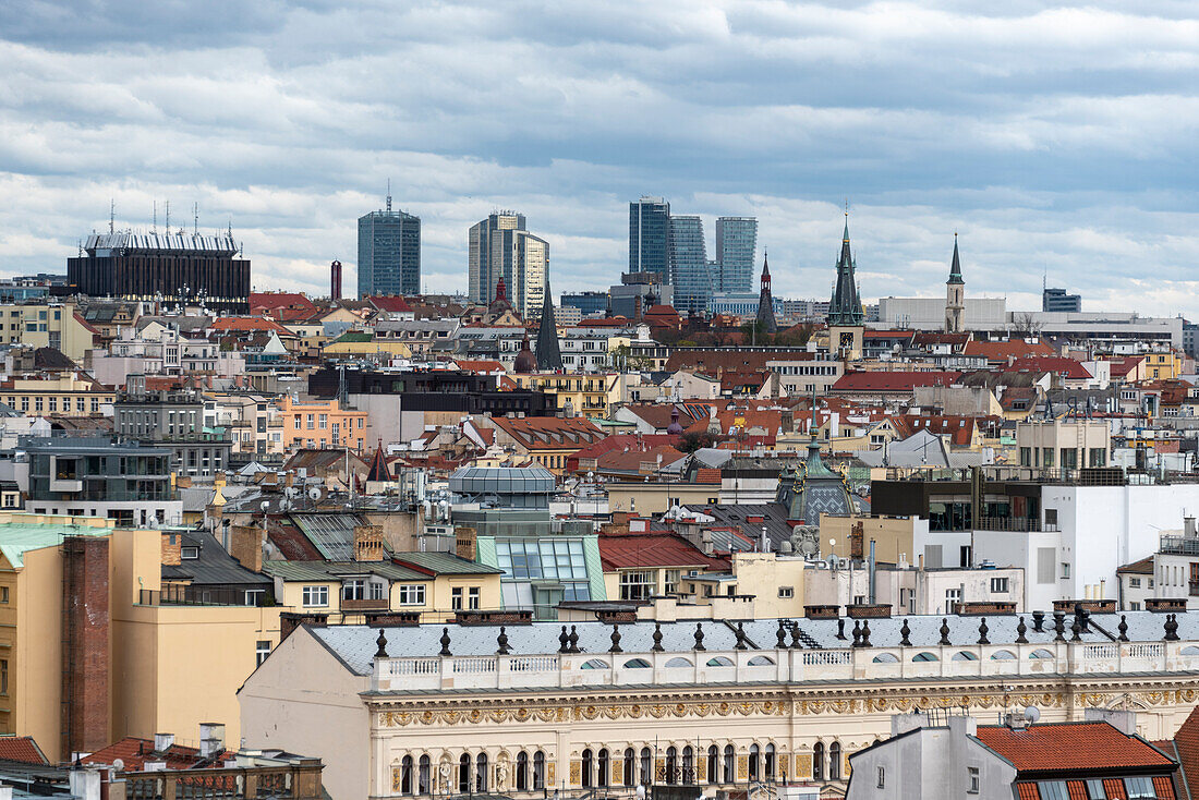 View over the rooftops of Prague, on the horizon V-Tower in the Nusle district, Prague, Czech Republic