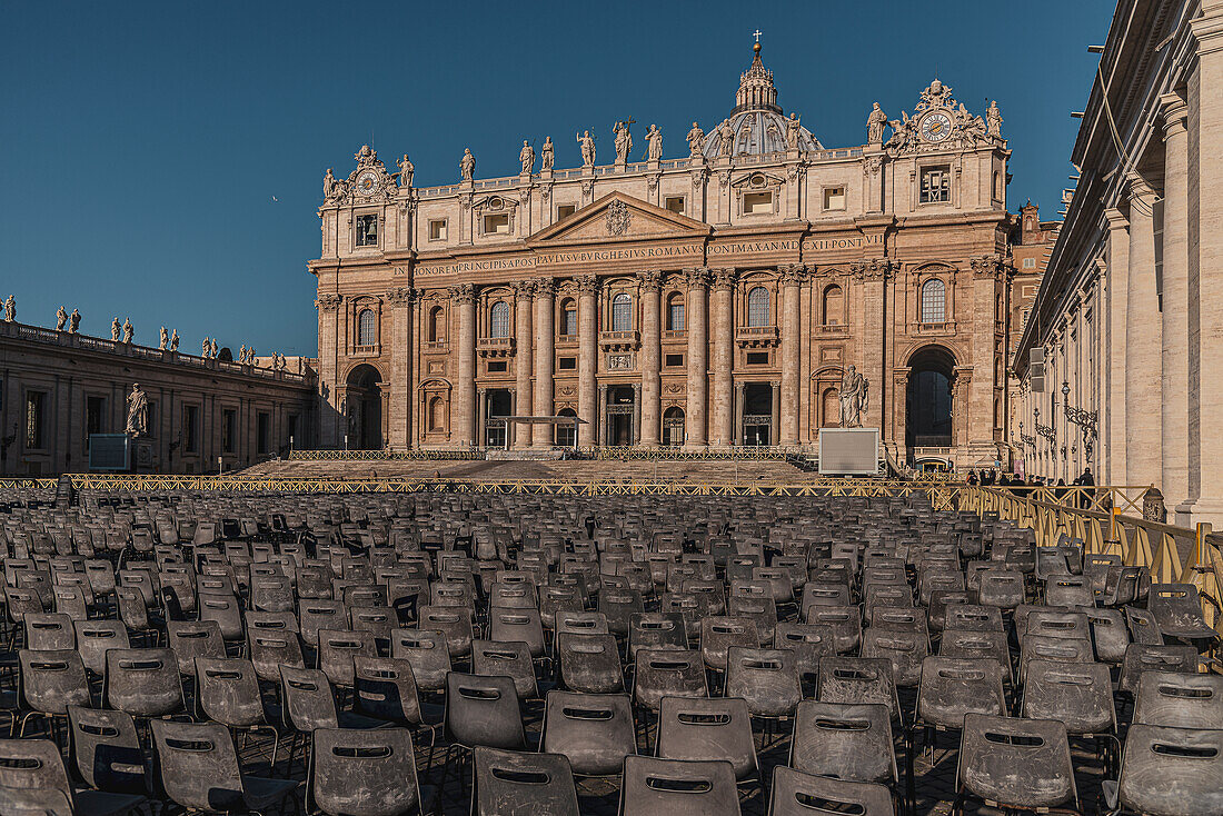 Row of seats at St. Peter's Basilica and Vatican Obelisk, Rome, Lazio, Italy, Europe