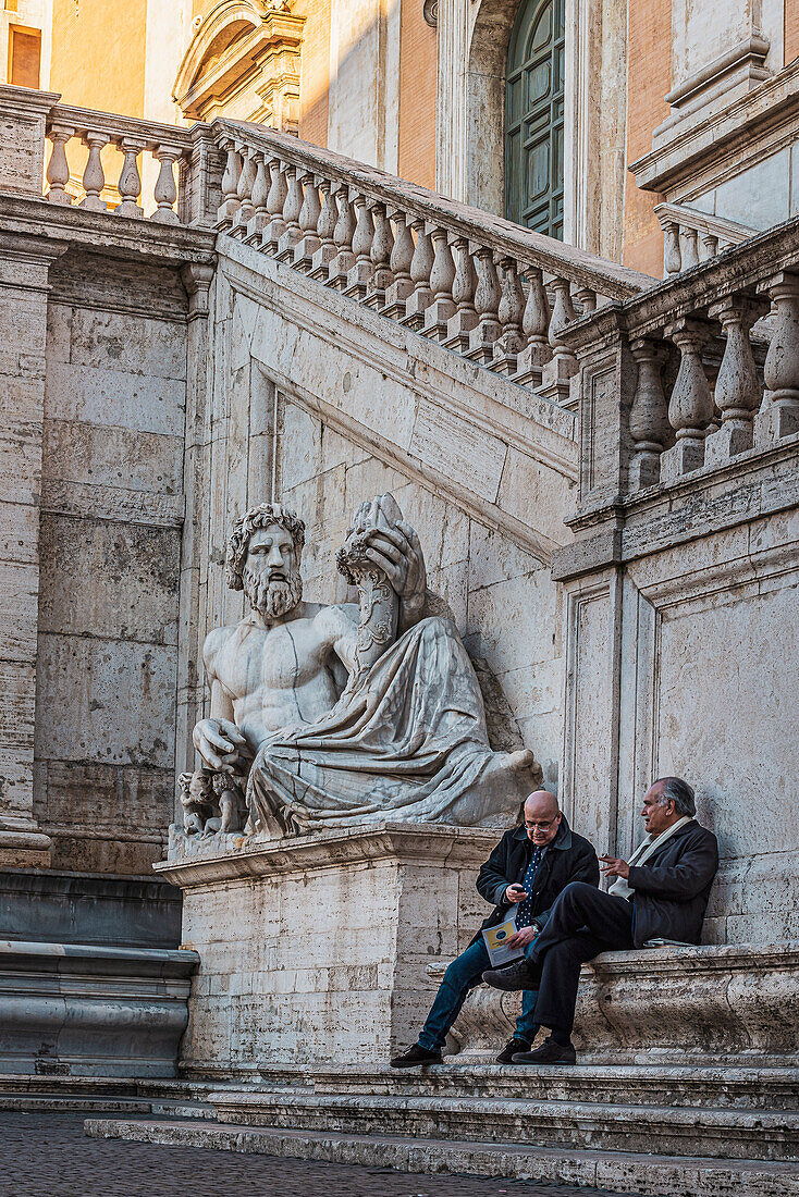 Old men at Michelangelo's double staircase at the Senator's Palace today's City Hall, Rome, Lazio, Italy, Europe