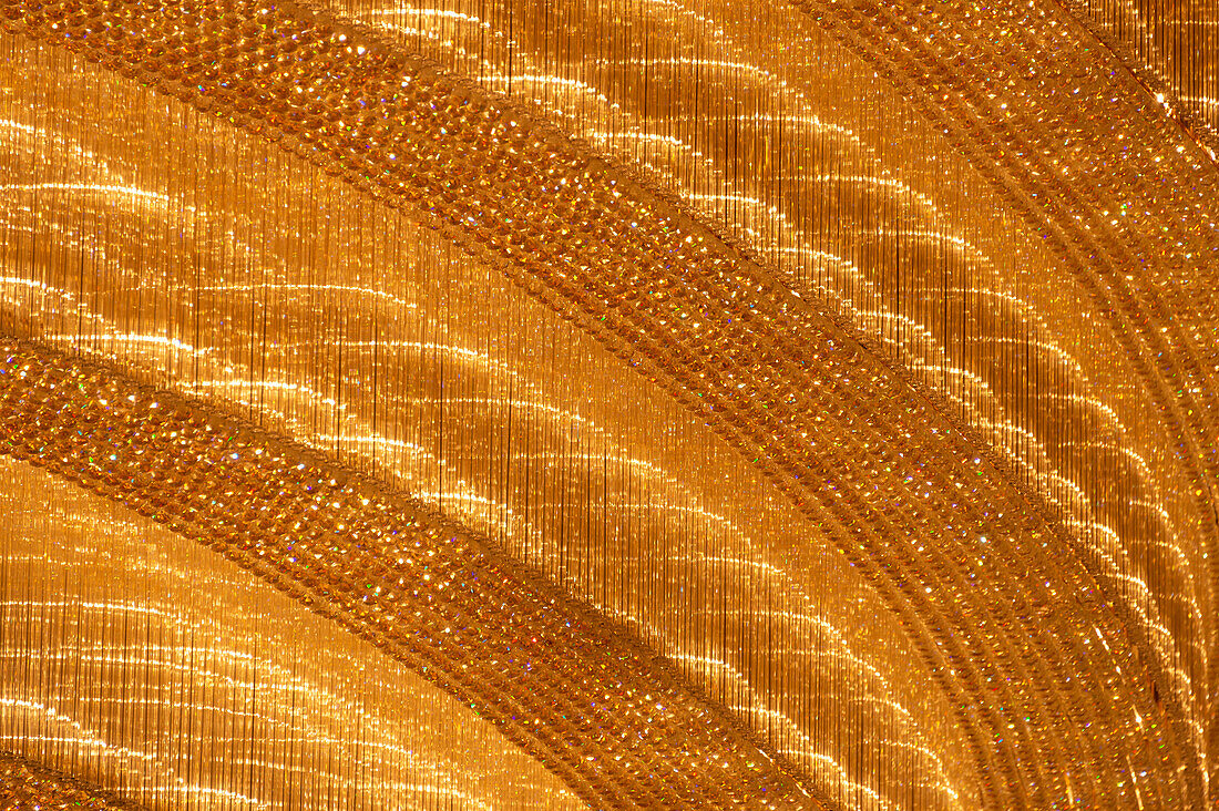Close up of a gold colored glass chandelier, Guangzhou, China