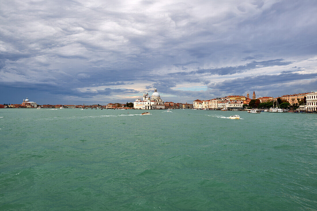 After a thunderstorm: view from the Venice Lagoon of the Chiesa di San Giorgio Maggiore, the Basilica di Santa Maria della Salute and the Basilica S.Maria Gloriosa dei Frari, Venice, Italy, Europe