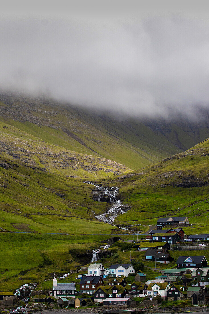 Houses of Sorvagur, Vagar, Faroe Islands. In the background waterfall.