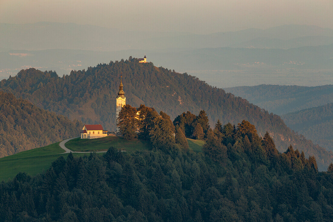 Church Zupnijska cerkev sv. Lenarta on mountain, in Dobrova-Polhov Gradec, Škofja Loka, Slovenia. Dawn