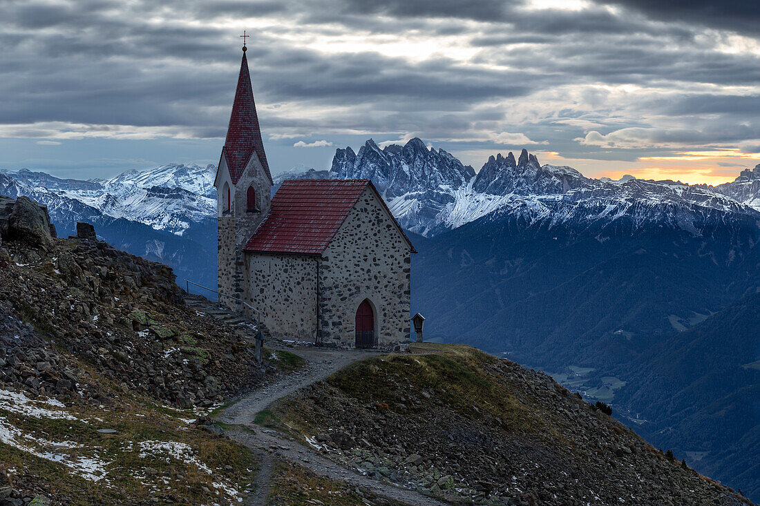 Church of the Holy Cross Latzfons, Latzfonser Kreuz, Chiusa, South Tyrol, Bozen, Italy. Sunrise, mountain panorama.