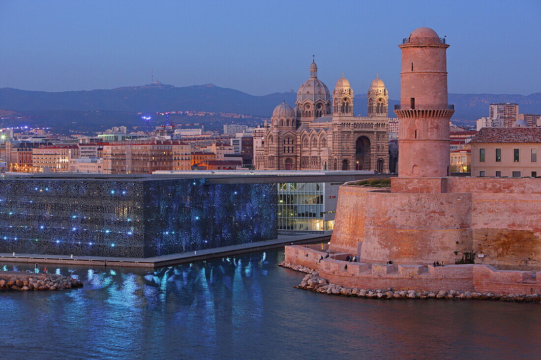 from left: MuCem (Museum of European and Mediterranean Civilizations), Cathedral de la Major and the Tour de Fanal of Fort Saint-Jean at the entrance of the Old Port of Marseille, Bouches-du-Rhone, Provence-Alpes-Cote d'39; Azure, France