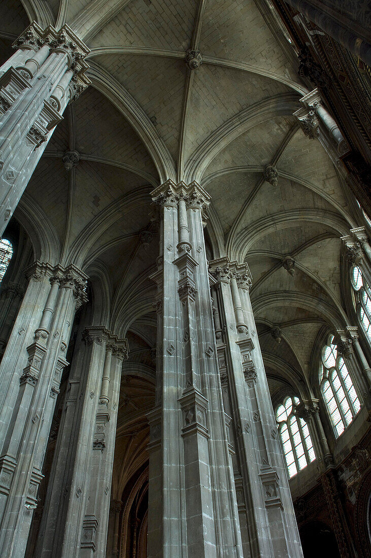 Looking up at the Renaissance pillars and ceiling in Saint Eustache church, Paris, France